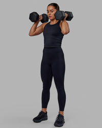 Woman wearing Flow Performance Tank - Black | Thumbnail Index: 4