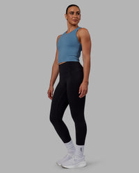 Woman wearing Flow Performance Tank - Elemental Blue | Thumbnail Index: 6