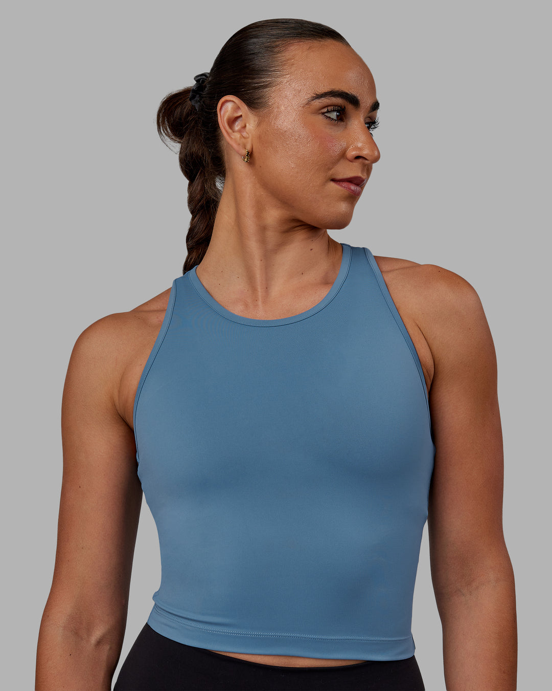 Woman wearing Flow Performance Tank - Elemental Blue - view 2