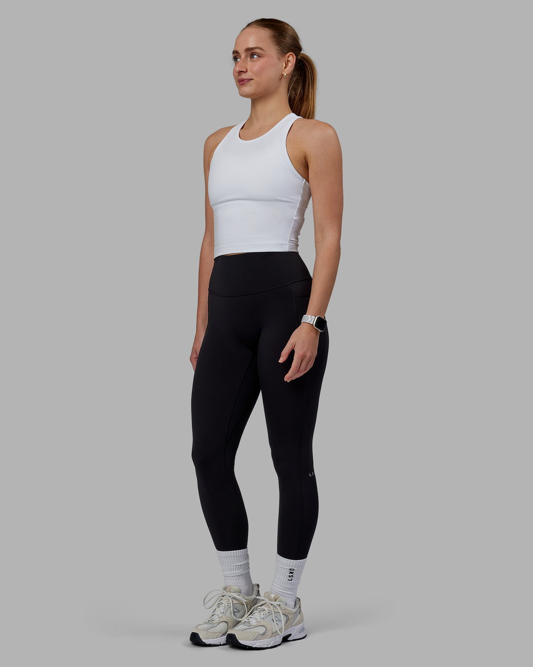 Woman wearing Flow Performance Tank - White - view 3