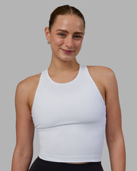 Woman wearing Flow Performance Tank - White | Thumbnail Index: 4