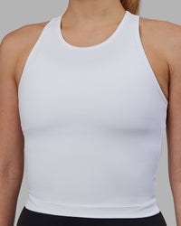 Woman wearing Flow Performance Tank - White | Thumbnail Index: 5