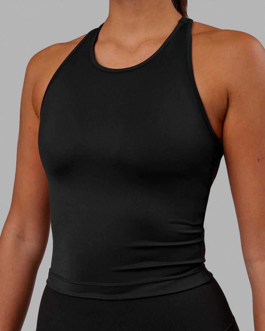 Woman wearing Flow Shelf Bra Performance Tank - Black - view 5