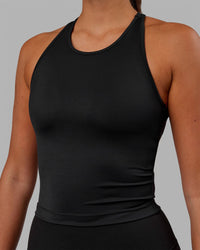 Woman wearing Flow Shelf Bra Performance Tank - Black | Thumbnail Index: 4