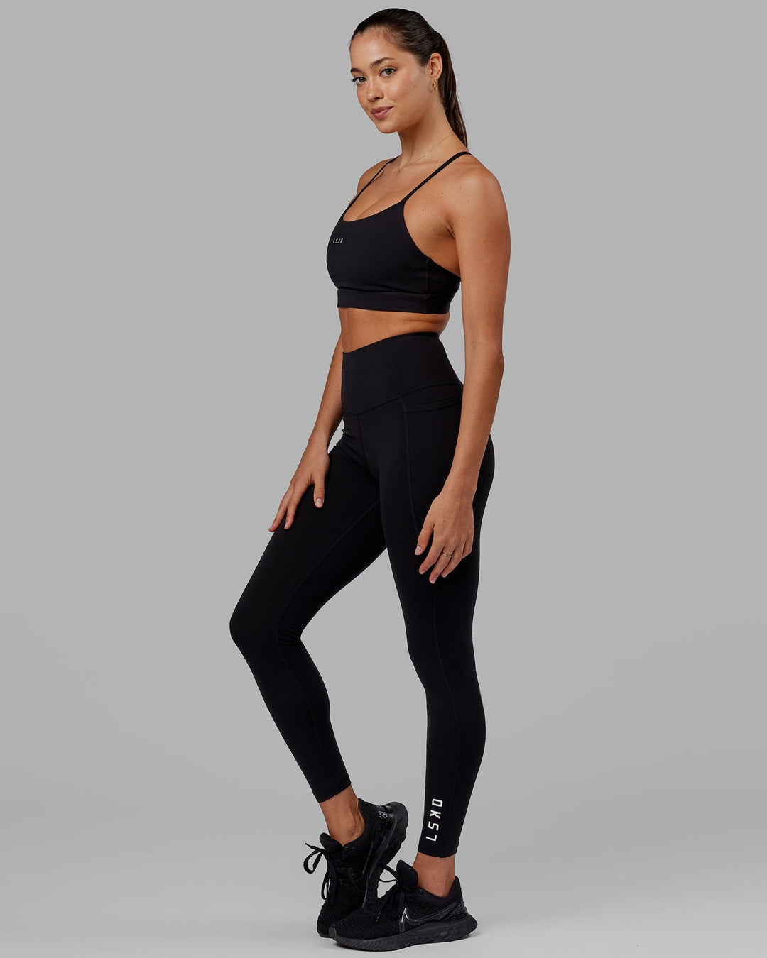 Woman wearing Flux Ultra High-Rise Full Length Legging Pockets - Black - view 3