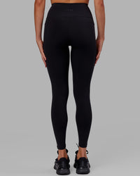 Woman wearing Flux Ultra High-Rise Full Length Legging Pockets - Black | Thumbnail Index: 3