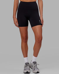 Woman wearing Flux Ultra High-Rise 6" Short Pockets - Black | Thumbnail Index: 9