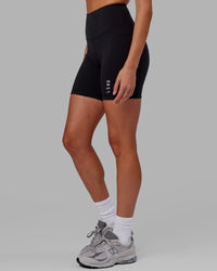 Woman wearing Flux Ultra High-Rise 6" Short Pockets - Black | Thumbnail Index: 7