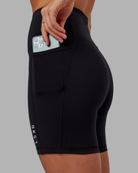 Woman wearing Flux Ultra High-Rise 6" Short Pockets - Black | Thumbnail Index: 4