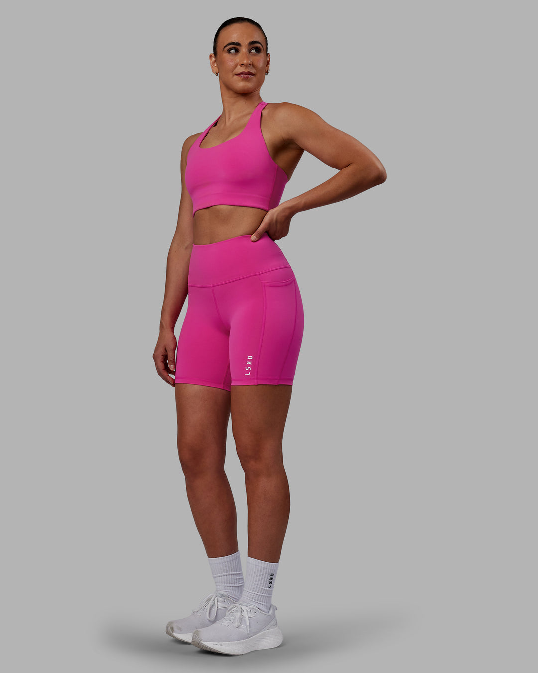Woman wearing Flux Ultra High-Rise 6" Short Pockets - Fuchsia Pink - view 5