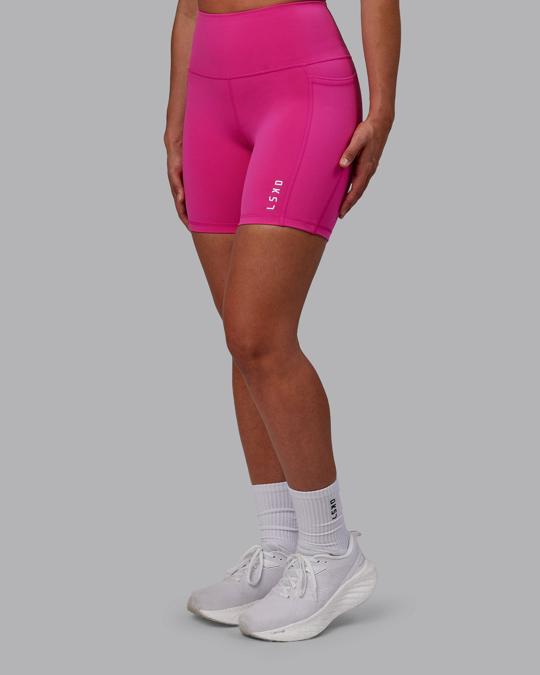 Woman wearing Flux Ultra High-Rise 6" Short Pockets - Fuchsia Pink - view 1