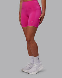 Woman wearing Flux Ultra High-Rise 6" Short Pockets - Fuchsia Pink | Thumbnail Index: 0