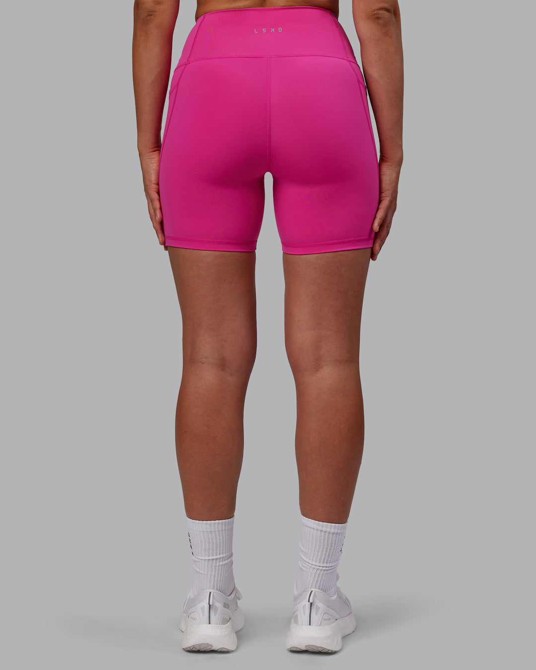 Woman wearing Flux Ultra High-Rise 6" Short Pockets - Fuchsia Pink - view 4
