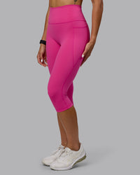 Woman wearing Fusion Ultra High-Rise 3/4 Legging Pockets - Fuchsia Pink | Model:Vanessa | Size:S | Thumbnail Index: 5