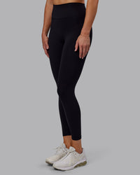 Woman wearing Fusion Ultra High-Rise 7/8 Legging - Black | Model:Hannah | Size:S | Thumbnail Index: 1