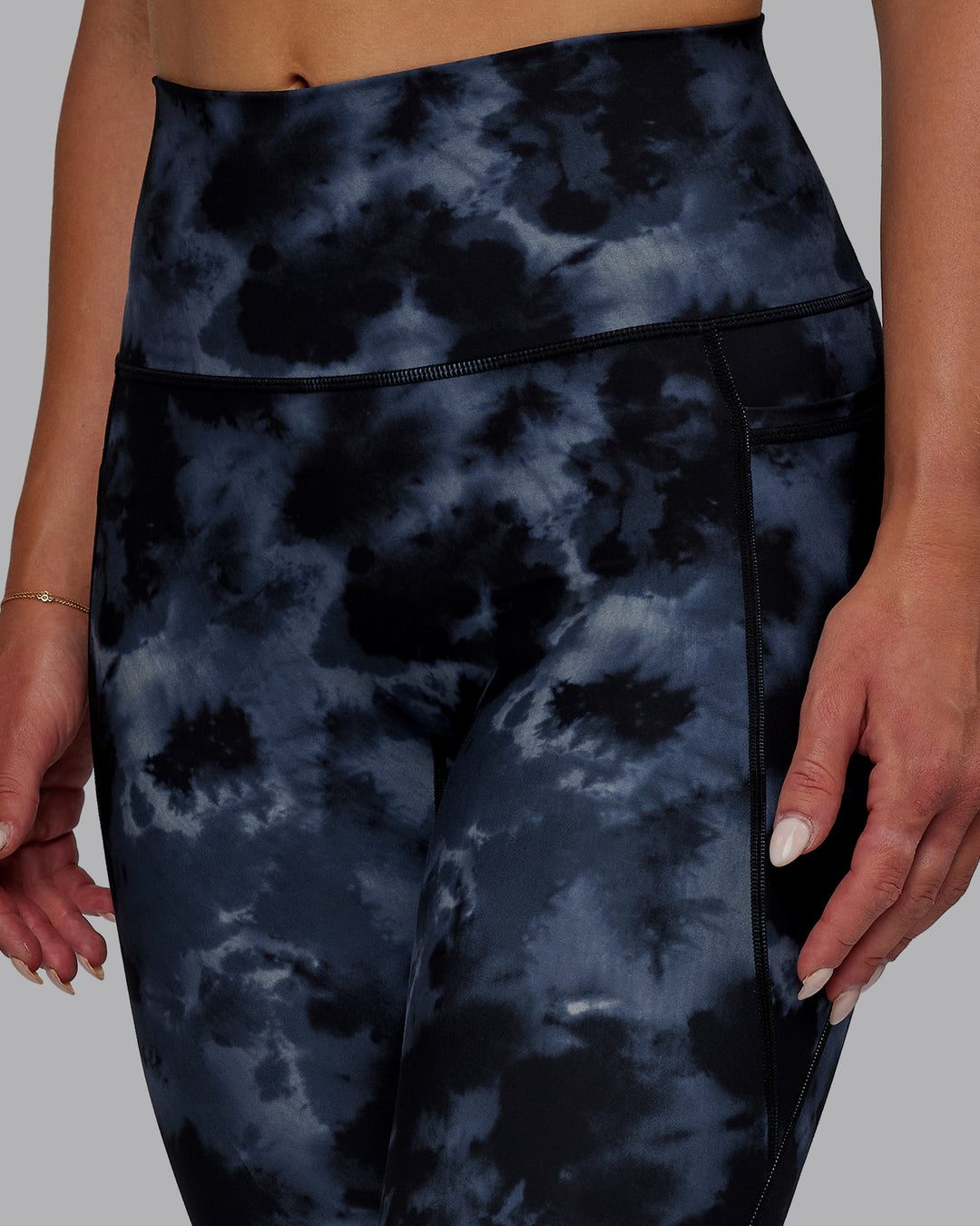 Woman wearing Fusion Ultra High-Rise 7/8 Legging Pockets - Tie Dye-Midnight | Model:Halle | Size:S - view 2
