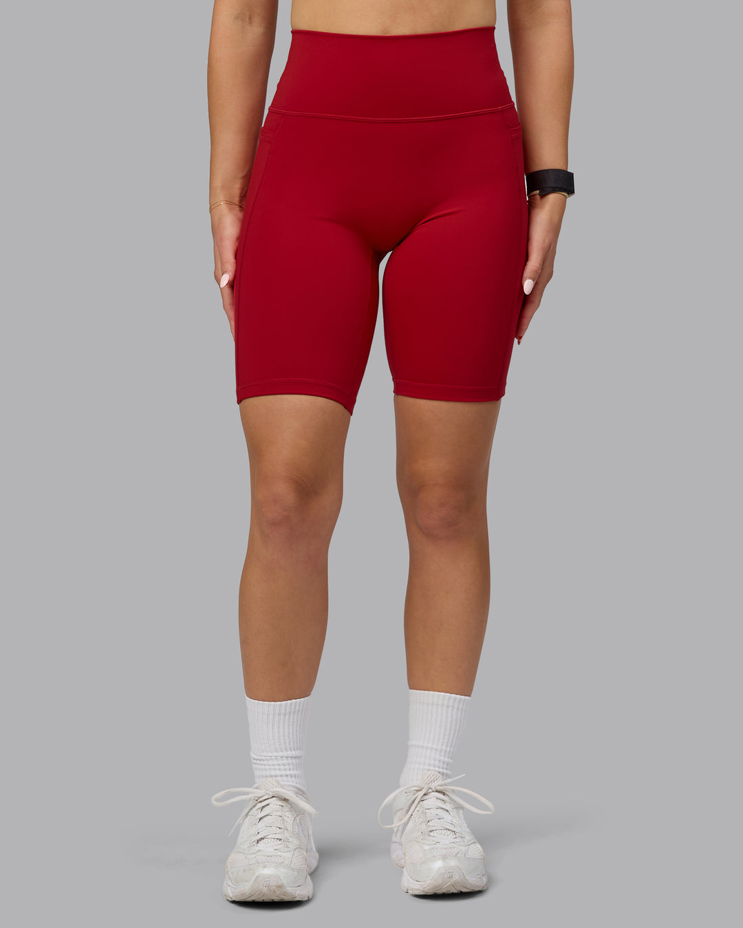 Woman wearing Fusion Ultra High-Rise 9" Short Pockets - Cherry Red | Model:Halle | Size:S - view 8