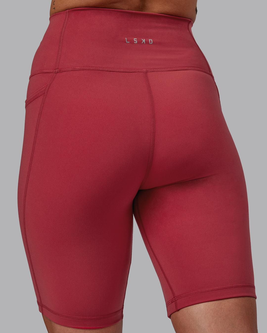 Woman wearing Fusion Ultra High-Rise 9" Short Pockets - Claret | Model:Blaize | Size:S - view 8