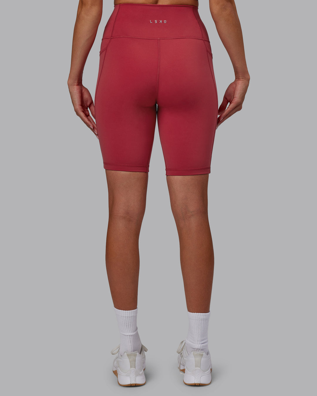 Woman wearing Fusion Ultra High-Rise 9" Short Pockets - Claret | Model:Blaize | Size:S - view 4