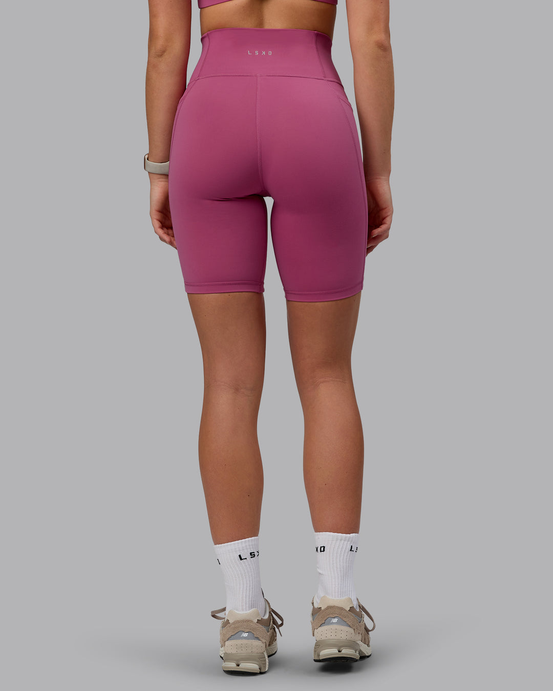 Woman wearing Fusion Ultra High-Rise 9" Short Pockets - Mauve Haze | Model:Chloe | Size:XS - view 3