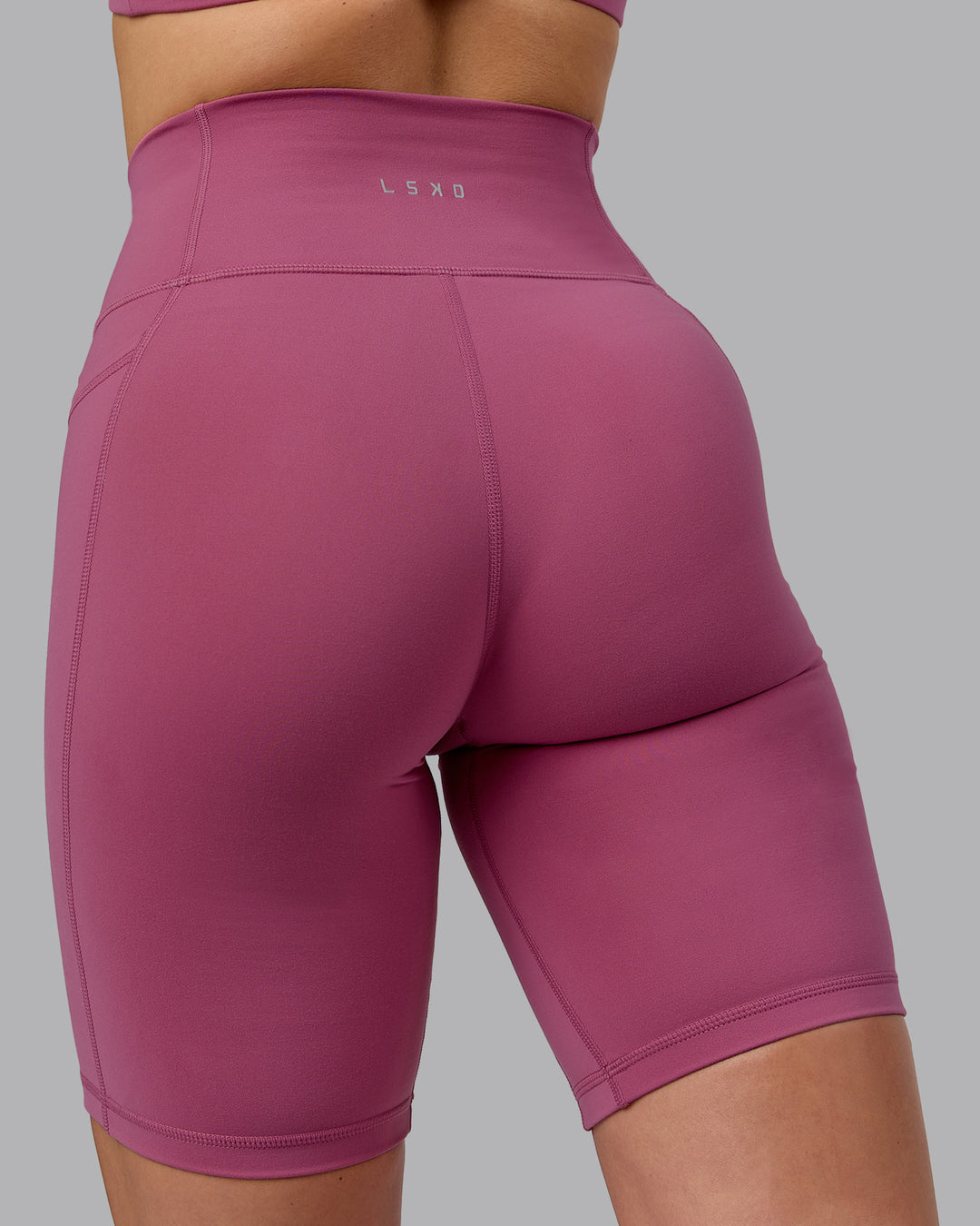 Woman wearing Fusion Ultra High-Rise 9" Short Pockets - Mauve Haze | Model:Chloe | Size:XS - view 7