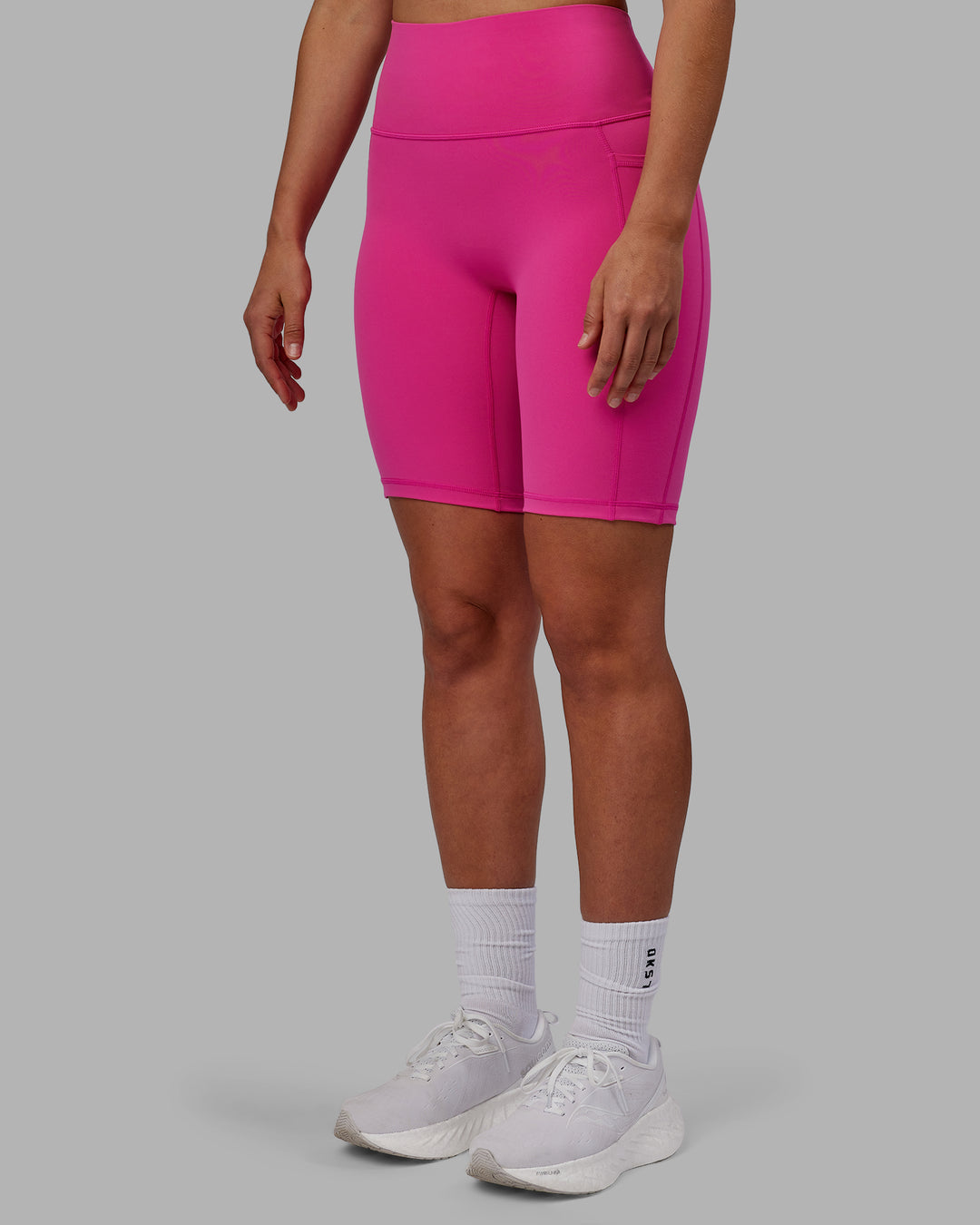 Woman wearing Fusion Ultra High-Rise 9" Short Pockets - Fuchsia Pink | Model:Sophie | Size:S - view 6