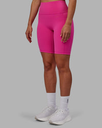 Woman wearing Fusion Ultra High-Rise 9" Short Pockets - Fuchsia Pink | Model:Sophie | Size:S | Thumbnail Index: 5