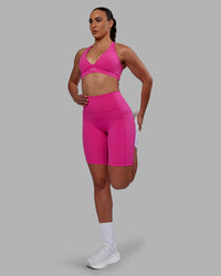 Woman wearing Fusion Ultra High-Rise 9" Short Pockets - Fuchsia Pink | Model:Sophie | Size:S | Thumbnail Index: 7