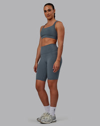 Woman wearing Fusion Ultra High-Rise 9" Short Pockets - Turbulence | Model:Sophie | Size:S | Thumbnail Index: 4