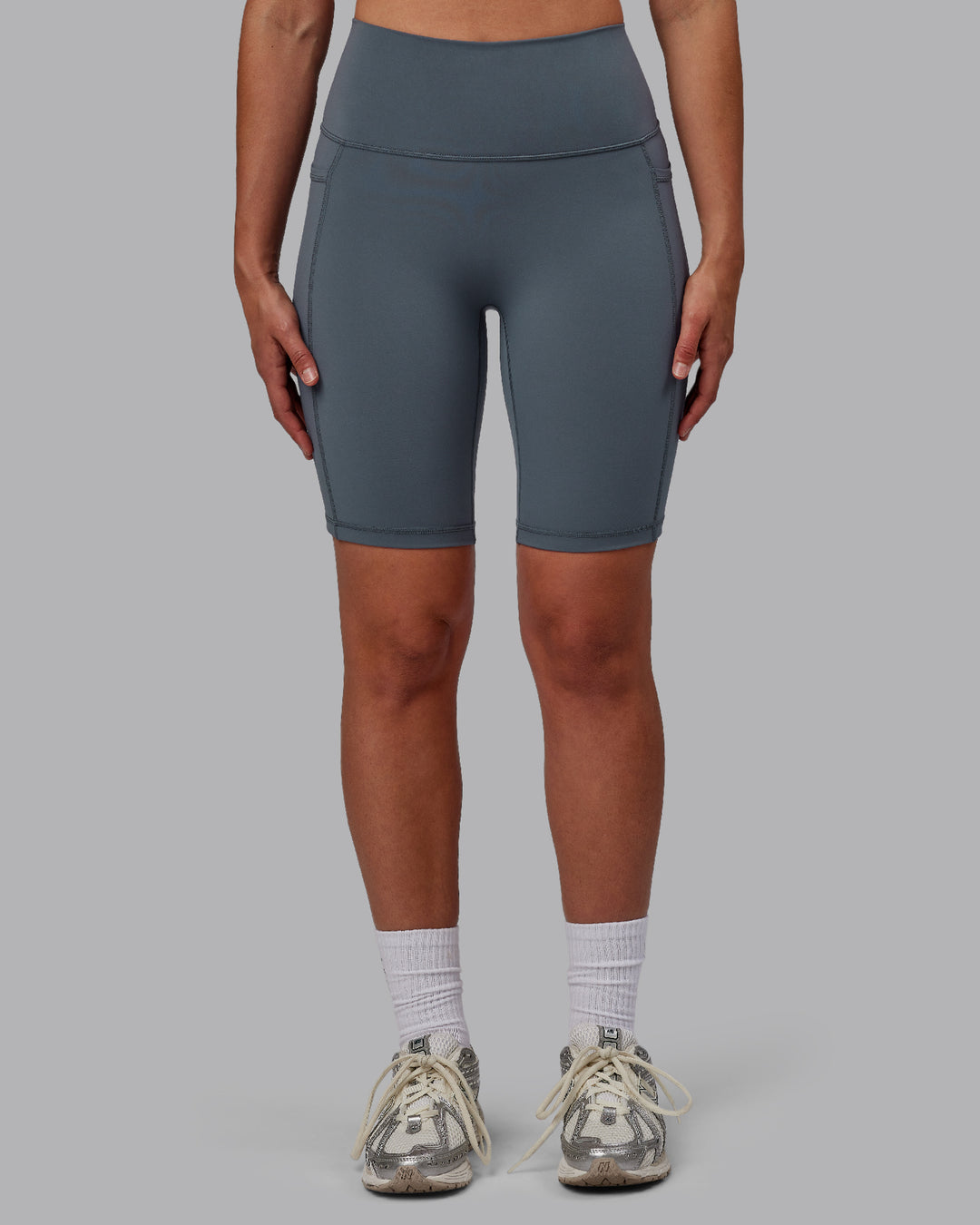Woman wearing Fusion Ultra High-Rise 9" Short Pockets - Turbulence | Model:Sophie | Size:S - view 7