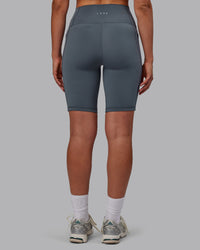 Woman wearing Fusion Ultra High-Rise 9" Short Pockets - Turbulence | Model:Sophie | Size:S | Thumbnail Index: 2