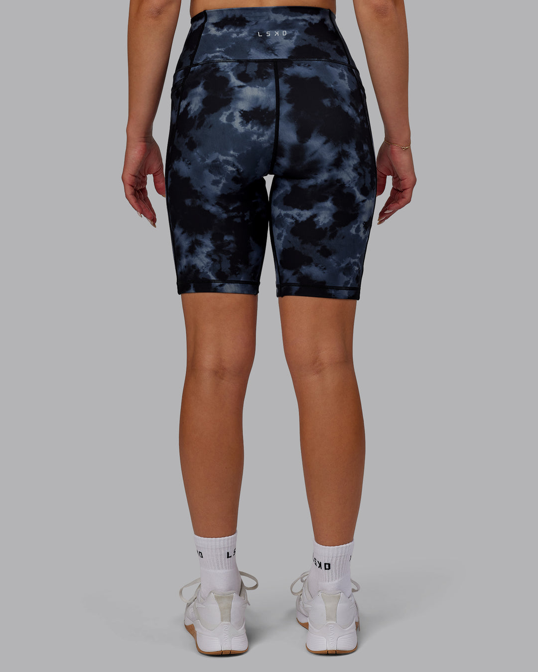 Woman wearing Fusion Ultra High-Rise 9" Short Pockets - Tie Dye-Midnight | Model:Halle | Size:S - view 4