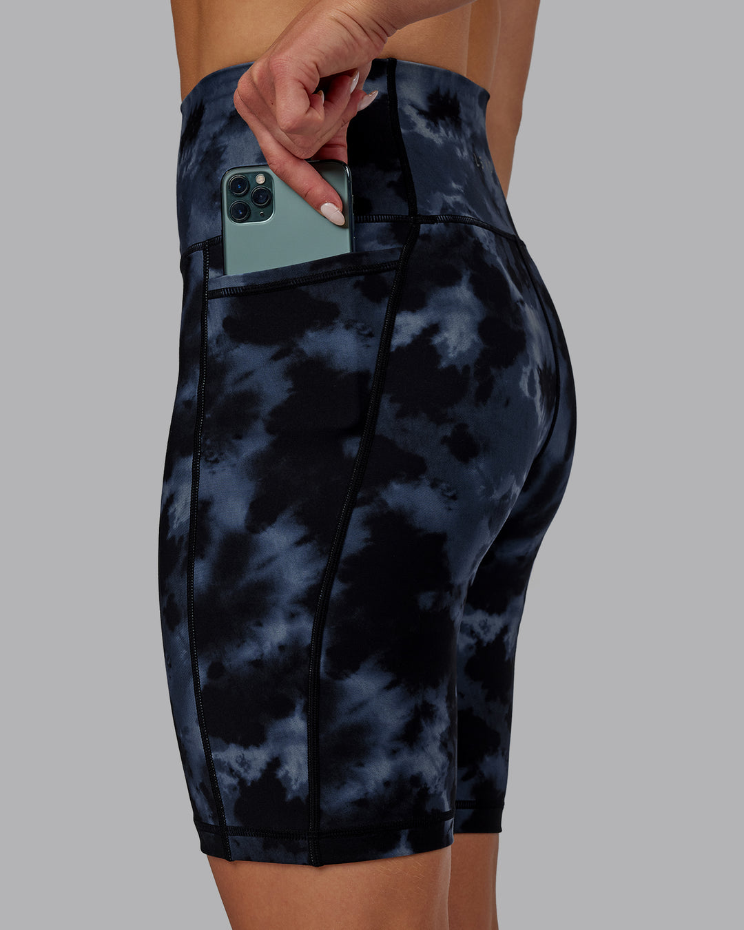 Woman wearing Fusion Ultra High-Rise 9" Short Pockets - Tie Dye-Midnight | Model:Halle | Size:S - view 3