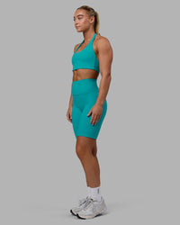 Woman wearing Fusion Ultra High-Rise 9" Short Pockets - Uplift Blue | Model:Monique | Size:S | Thumbnail Index: 3