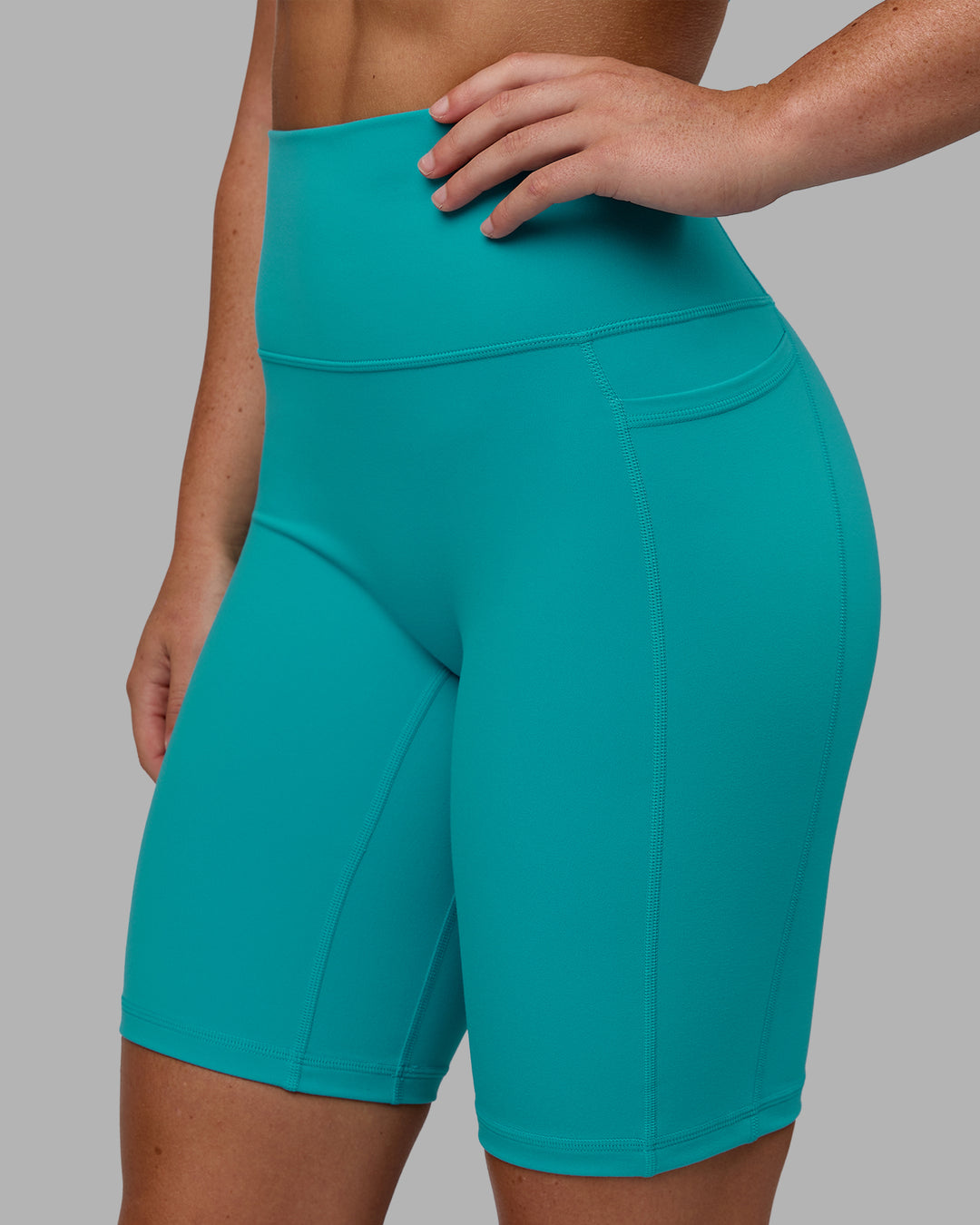 Woman wearing Fusion Ultra High-Rise 9" Short Pockets - Uplift Blue | Model:Monique | Size:S - view 6
