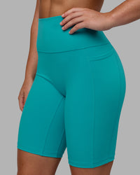 Woman wearing Fusion Ultra High-Rise 9" Short Pockets - Uplift Blue | Model:Monique | Size:S | Thumbnail Index: 5