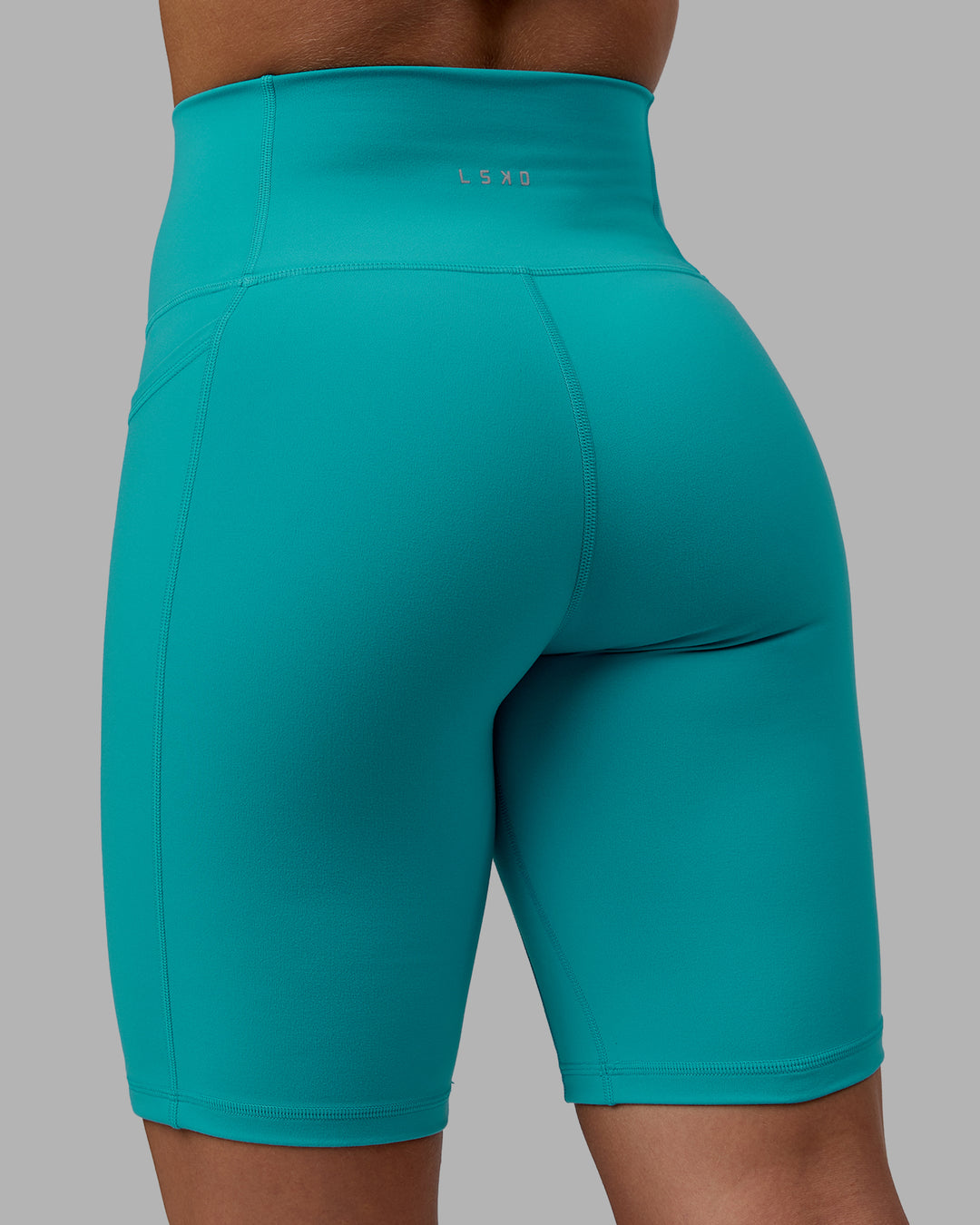 Woman wearing Fusion Ultra High-Rise 9" Short Pockets - Uplift Blue | Model:Monique | Size:S - view 7