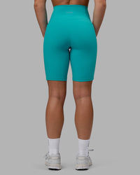 Woman wearing Fusion Ultra High-Rise 9" Short Pockets - Uplift Blue | Model:Monique | Size:S | Thumbnail Index: 2