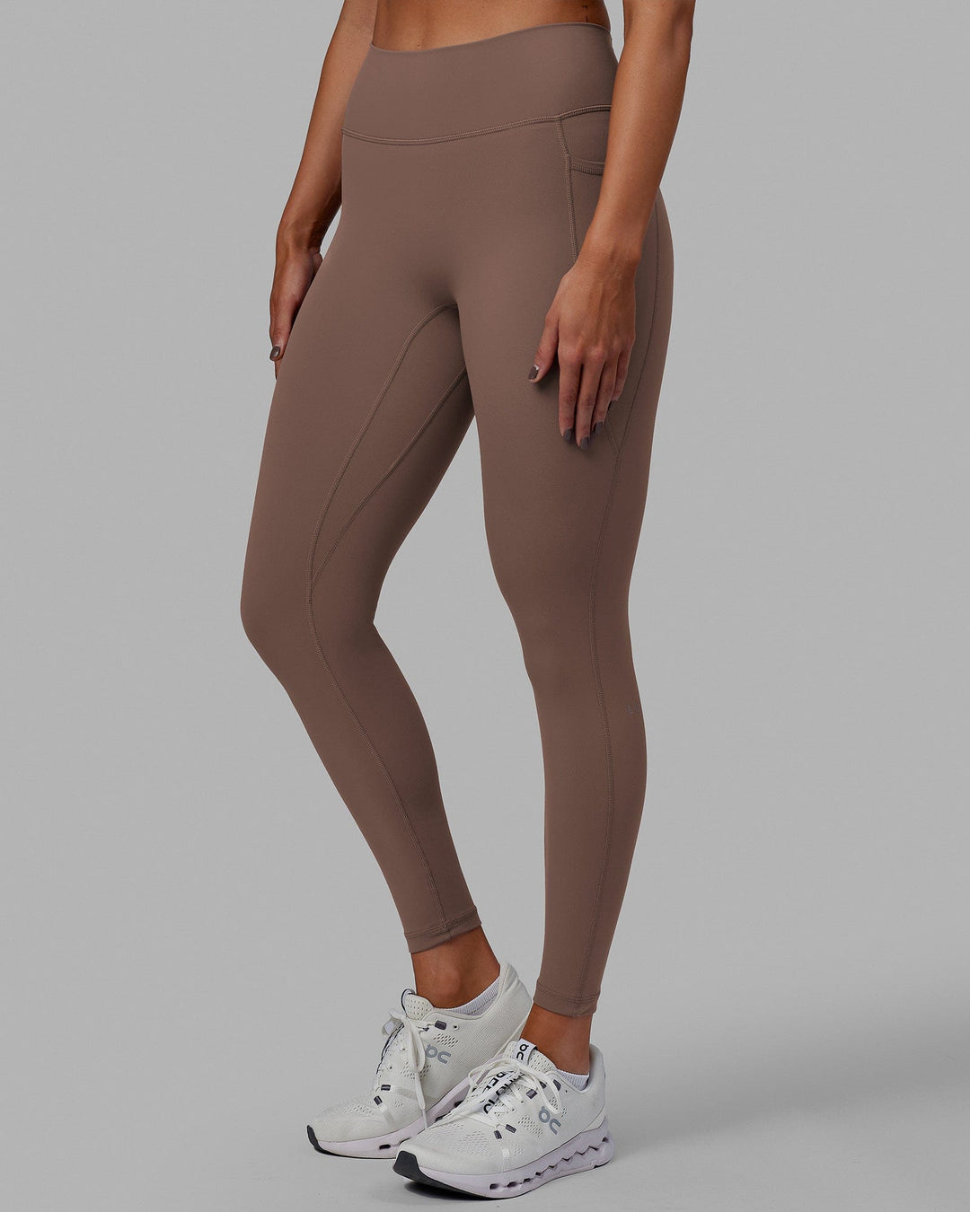 Woman wearing Fusion Ultra High-Rise Full Length Legging Pockets - Deep Taupe | Model:Blaize | Size:S - view 1