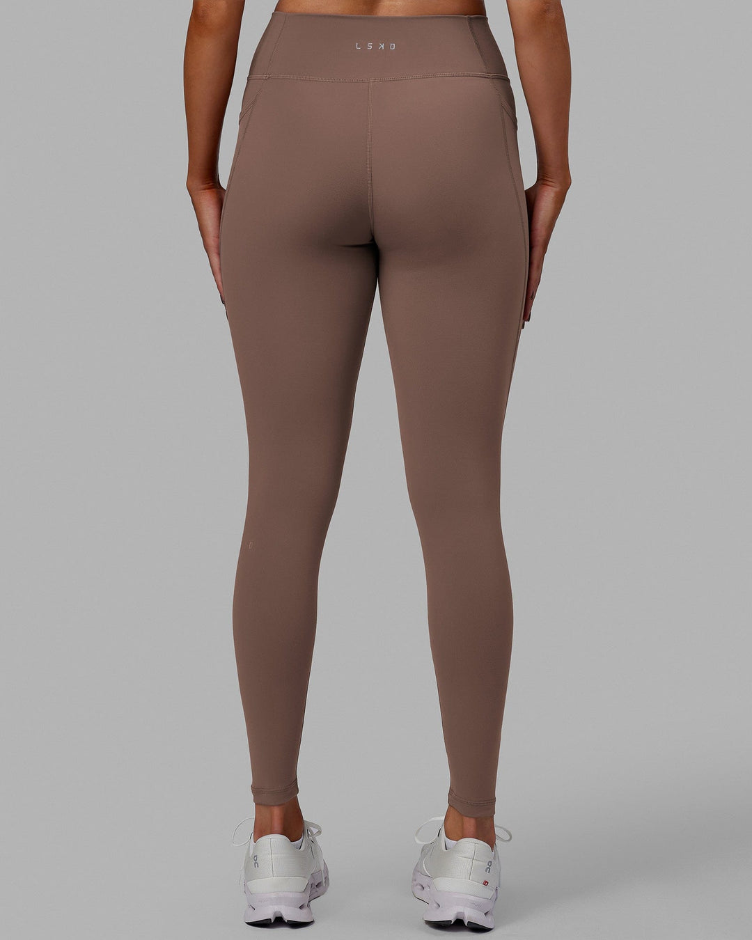 Woman wearing Fusion Ultra High-Rise Full Length Legging Pockets - Deep Taupe | Model:Blaize | Size:S - view 4