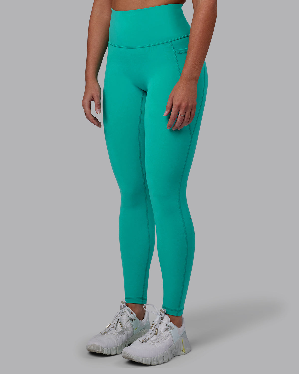Woman wearing Fusion Ultra High-Rise Full Length Legging Pockets - Turquoise Tide | Model:Hannah | Size:S