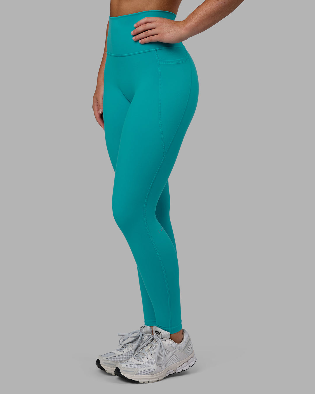 Woman wearing Fusion Ultra High-Rise Full Length Legging Pockets - Uplift Blue | Model:Monique | Size:S - view 8