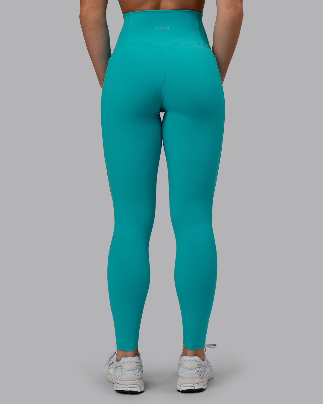 Woman wearing Fusion Ultra High-Rise Full Length Legging Pockets - Uplift Blue | Model:Monique | Size:S - view 4