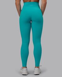 Woman wearing Fusion Ultra High-Rise Full Length Legging Pockets - Uplift Blue | Model:Monique | Size:S | Thumbnail Index: 3