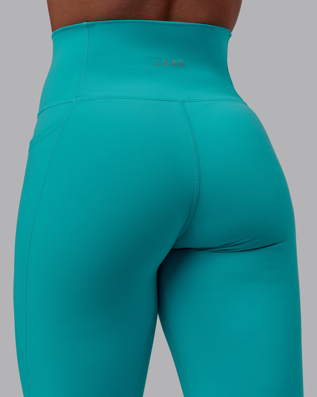 Woman wearing Fusion Ultra High-Rise Full Length Legging Pockets - Uplift Blue | Model:Monique | Size:S - view 10