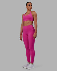 Woman wearing Fusion Ultra High-Rise Full Length Legging Pockets - Fuchsia Pink | Model:Sophie | Size:S | Thumbnail Index: 3