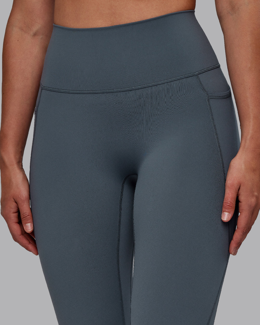 Woman wearing Fusion Ultra High-Rise Full Length Legging Pockets - Turbulence | Model:Sophie | Size:S - view 4
