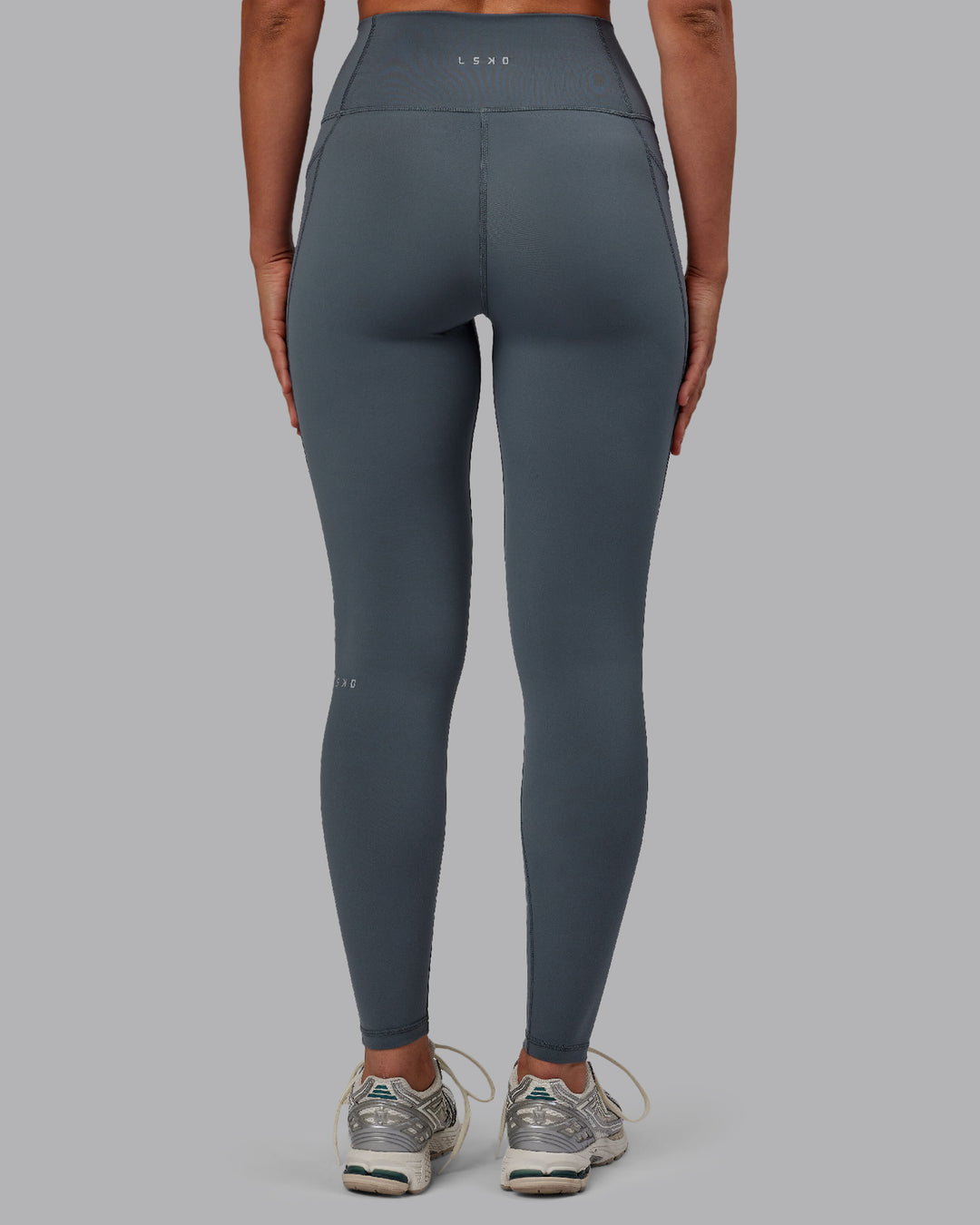 Woman wearing Fusion Ultra High-Rise Full Length Legging Pockets - Turbulence | Model:Sophie | Size:S - view 3