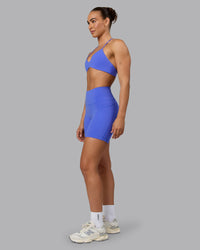 Woman wearing Fusion Ultra High-Rise 6" Short Pockets - Baja Blue | Model:Sophie | Size:S | Thumbnail Index: 4