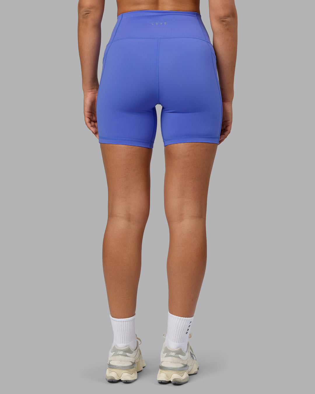 Woman wearing Fusion Ultra High-Rise 6" Short Pockets - Baja Blue | Set:true | Angle:back | Model:Sophie | Size:S - view 3